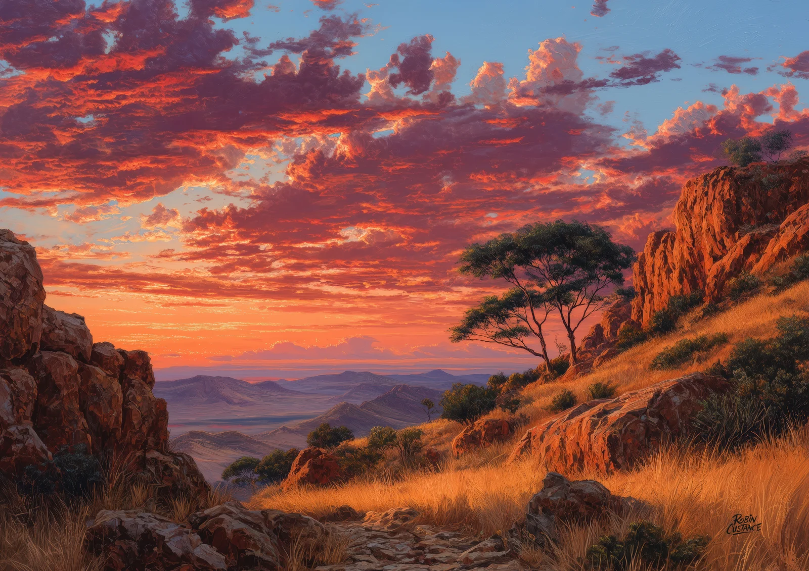 Crimson and plum sunset clouds glow above distant violet hills, framed by dark foreground rocks and an orange grassy slope with a silhouetted tree on the right.